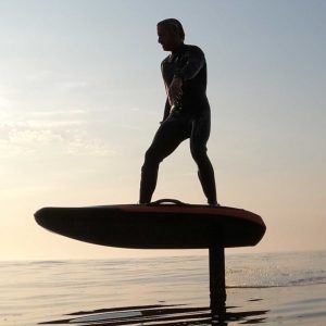 eFoiling: Electrically driven across the water through air surfing